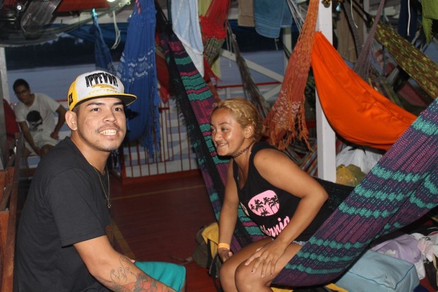 Passengers exchanging stories on deck after dark